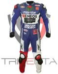 A professional motorcycle racing suit standing upright without a person inside. The suit is predominantly blue with white and black accents, featuring multiple sponsor logos including ‘Movistar,’ ‘ENEOS,’ and ‘Monster Energy.’ Red knee pucks are visible on the legs, and the suit appears to be designed for high-performance motorbike racing with protective elements and branding.