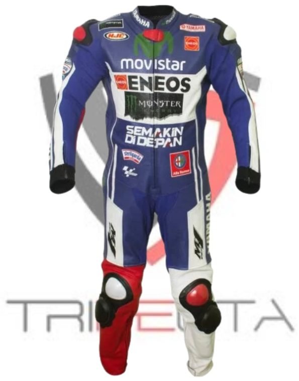 A professional motorcycle racing suit standing upright without a person inside. The suit is predominantly blue with white and black accents, featuring multiple sponsor logos including ‘Movistar,’ ‘ENEOS,’ and ‘Monster Energy.’ Red knee pucks are visible on the legs, and the suit appears to be designed for high-performance motorbike racing with protective elements and branding.