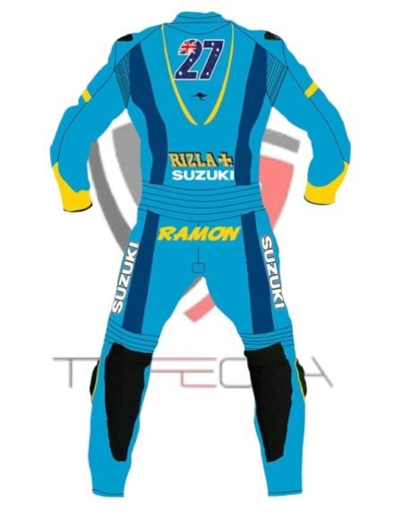 “A sleek, professional motorcycle racing suit in blue with black and yellow accents, prominently featuring the Suzuki logo and sponsor patches like Monster Energy, Motul, and Yoshimura. The suit is designed with aerodynamic humps and pre-curved sleeves for optimal performance, displayed against a clean white background