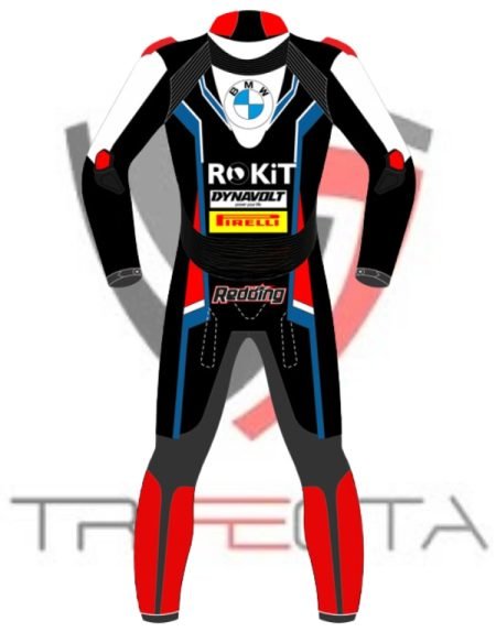 “A digital illustration of a motorcycle racing suit. The suit is predominantly black with red and white accents. It features several logos and text: ‘ROKiT’ in large white letters on the torso, ‘DYN’ in white on the right arm, ‘AVOLT’ in white on the left arm, and ‘Rea’ in red on the right leg with ‘ding’ in white on the left leg. The suit has a blue circular logo with a stylized face wearing sunglasses and a helmet above the word ‘ROKiT.’ There are protective pads visible on the shoulders, elbows, and knees. The design includes intricate patterns and lines that suggest speed and dynamism